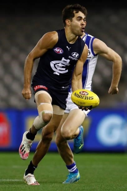 Jack Martin of the Blues handballs during the round 19 AFL match between Carlton Blues and North Melbourne Kangaroos s at Marvel Stadium on July 24,...