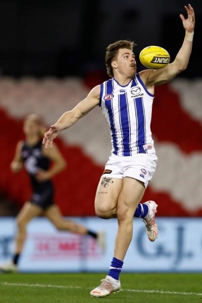 Cameron Zurhaar of the Kangaroos gathers the ball during the round 19 AFL match between Carlton Blues and North Melbourne Kangaroos s at Marvel...