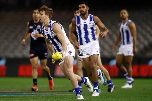 Trent Dumont of the Kangaroos runs with the ball during the round 19 AFL match between Carlton Blues and North Melbourne Kangaroos s at Marvel...