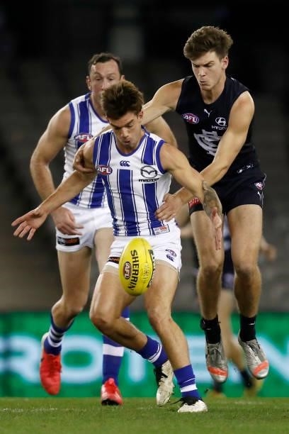 Jy Simpkin of the Kangaroos kicks the ball during the round 19 AFL match between Carlton Blues and North Melbourne Kangaroos s at Marvel Stadium on...
