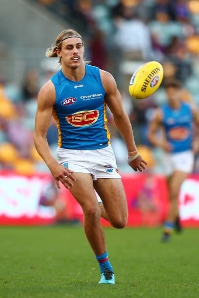 Jeremy Sharp of the Suns handballs during the round 20 AFL match between Brisbane Lions and Gold Coast Suns at The Gabba on July 24, 2021 in...