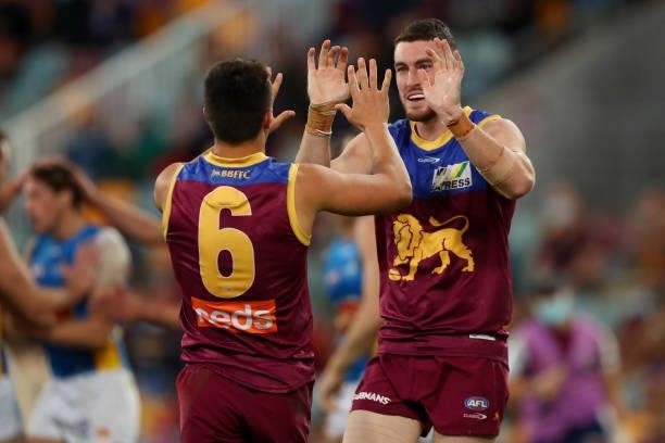 Daniel McStay of the Lions celebrates his goal during the round 20 AFL match between Brisbane Lions and Gold Coast Suns at The Gabba on July 24, 2021...