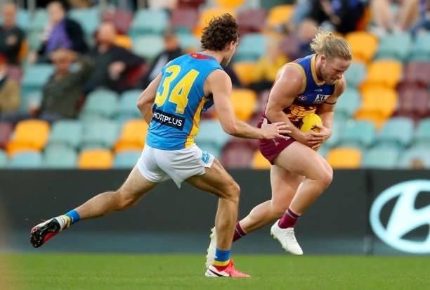 Daniel Rich of the Lions marks the ball during the round 20 AFL match between Brisbane Lions and Gold Coast Suns at The Gabba on July 24, 2021 in...