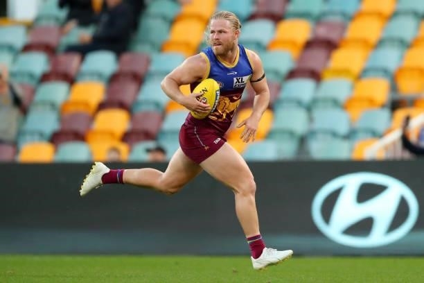 Daniel Rich of the Lions runs with the ball during the round 20 AFL match between Brisbane Lions and Gold Coast Suns at The Gabba on July 24, 2021 in...