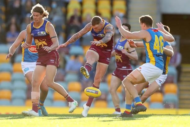 Mitch Robinson of the Lions kicks the ball during the round 20 AFL match between Brisbane Lions and Gold Coast Suns at The Gabba on July 24, 2021 in...