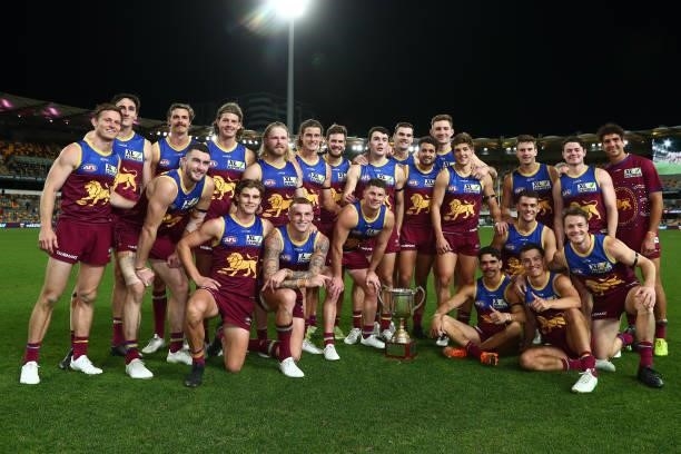 Lions celebrate winning the Q Clash during the round 20 AFL match between Brisbane Lions and Gold Coast Suns at The Gabba on July 24, 2021 in...