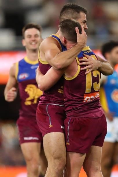Dayne Zorko of the Lions and Brandon Starcevich of the Lions celebrate during the round 20 AFL match between Brisbane Lions and Gold Coast Suns at...