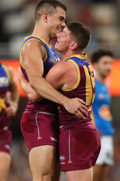 Dayne Zorko of the Lions and Brandon Starcevich of the Lions celebrate during the round 20 AFL match between Brisbane Lions and Gold Coast Suns at...