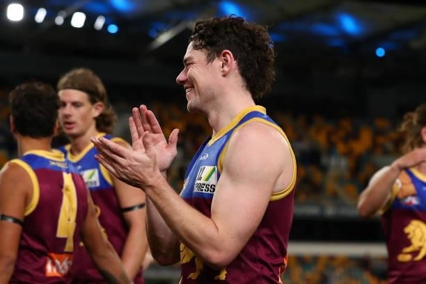Lachie Neale of the Lions celebrates the win during the round 20 AFL match between Brisbane Lions and Gold Coast Suns at The Gabba on July 24, 2021...