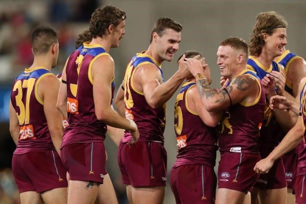 Mitch Robinson of the Lions celebrates with Dayne Zorko of the Lions during the round 20 AFL match between Brisbane Lions and Gold Coast Suns at The...