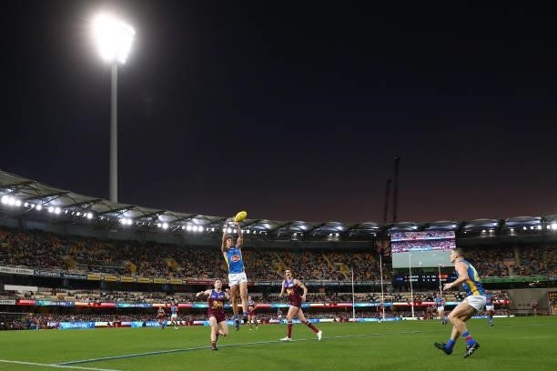 Sean Lemmens of the Suns marks the ball during the round 20 AFL match between Brisbane Lions and Gold Coast Suns at The Gabba on July 24, 2021 in...