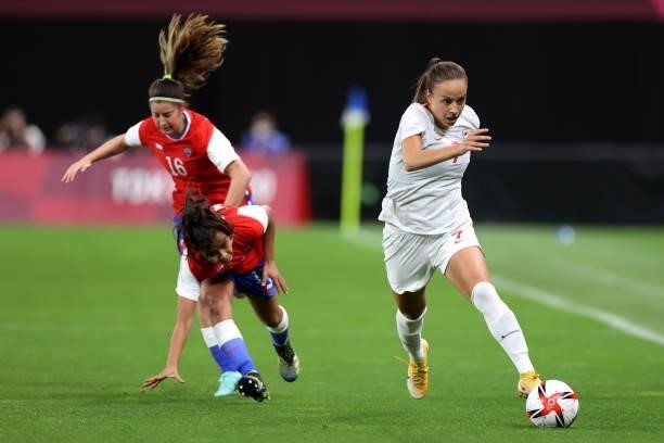 Julia Grosso of Team Canada breaks away with the ball during the Women's First Round Group E match between Chile and Canada on day one of the Tokyo...