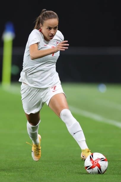 Julia Grosso of Team Canada breaks away with the ball during the Women's First Round Group E match between Chile and Canada on day one of the Tokyo...