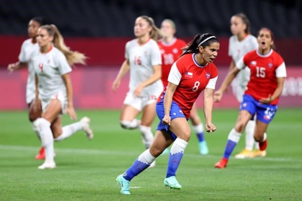 Karen Araya of Team Chile celebrates after scoring their side's first goal from the penalty spot during the Women's First Round Group E match between...