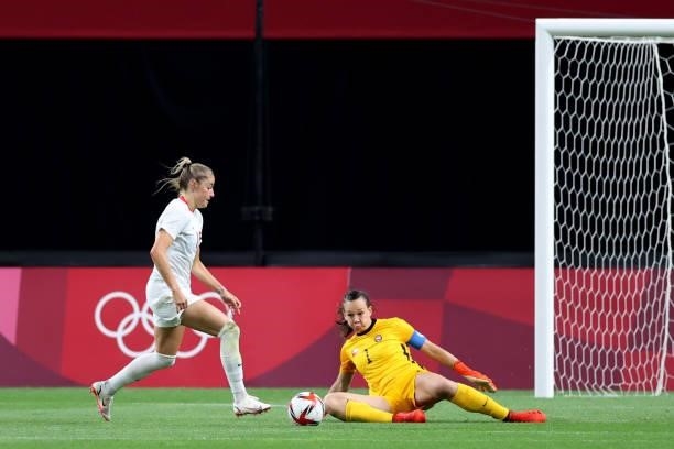 Janine Beckie of Team Canada goes round Christiane Endler of Team Chile to score their side's second goal during the Women's First Round Group E...