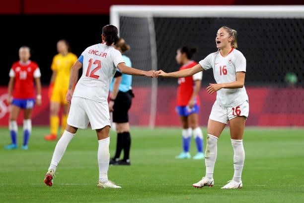 Janine Beckie of Team Canada is congratulated by teammate Christine Sinclair after scoring their side's second goal during the Women's First Round...