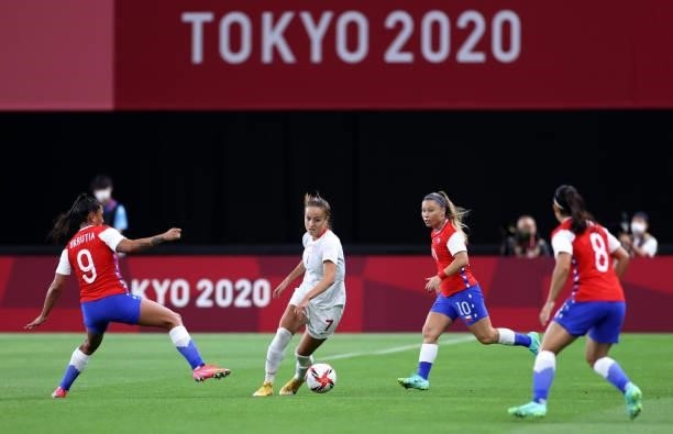 Julia Grosso of Team Canada runs with the ball during the Women's First Round Group E match between Chile and Canada on day one of the Tokyo 2020...