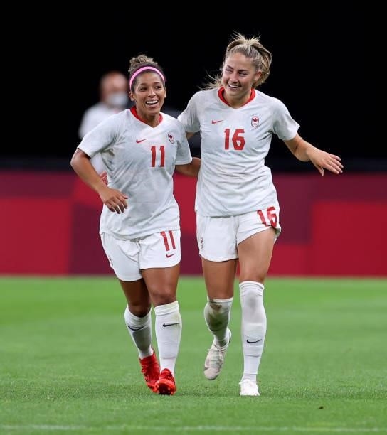 Janine Beckie of Team Canada celebrates with teammate Desiree Scott after scoring their side's second goal during the Women's First Round Group E...