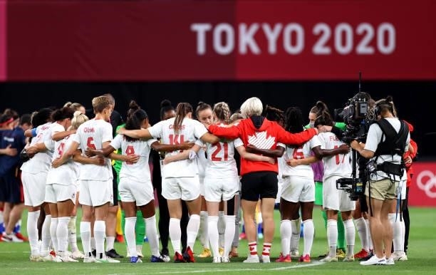 Players of Team Canada form a huddle following victory in the Women's First Round Group E match between Chile and Canada on day one of the Tokyo 2020...