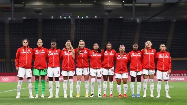 Players of Team Canada stand for the national anthem prior to the Women's First Round Group E match between Chile and Canada on day one of the Tokyo...