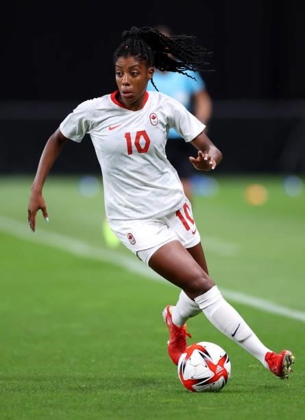 Ashley Lawrence of Team Canada runs with the ball during the Women's First Round Group E match between Chile and Canada on day one of the Tokyo 2020...