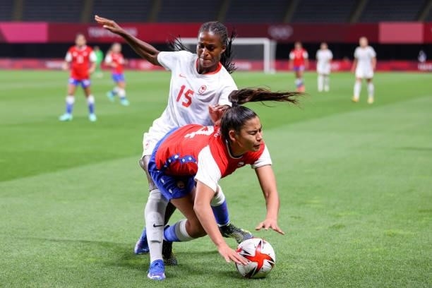 Daniela Pardo of Team Chile is challenged by Nichelle Prince of Team Canada during the Women's First Round Group E match between Chile and Canada on...