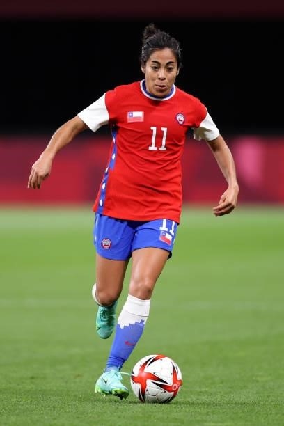 Yessenia Lopez of Team Chile runs with the ball during the Women's First Round Group E match between Chile and Canada on day one of the Tokyo 2020...