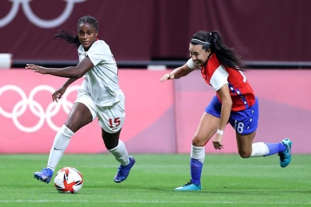 Nichelle Prince of Team Canada gets away from Camila Saez of Team Chile during the Women's First Round Group E match between Chile and Canada on day...