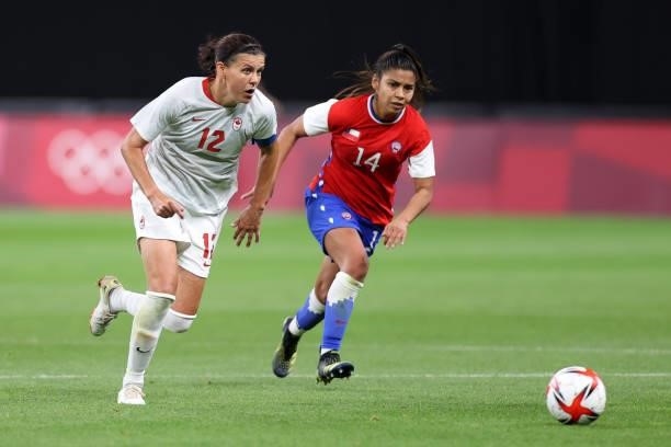 Christine Sinclair of Team Canada battles for possession with Daniela Pardo of Team Chile during the Women's First Round Group E match between Chile...