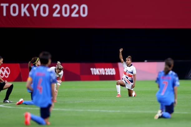 Nikita Parris of Team Great Britain takes a knee in support of the Black Lives Matter movement prior to the Women's First Round Group E match between...