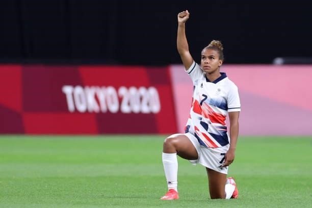 Nikita Parris of Team Great Britain takes a knee in support of the Black Lives Matter movement prior to the Women's First Round Group E match between...