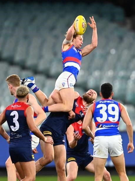 Cody Weightman of the Bulldogs marks over Max Gawn of the Demons during the round 20 AFL match between Melbourne Demons and Western Bulldogs at...