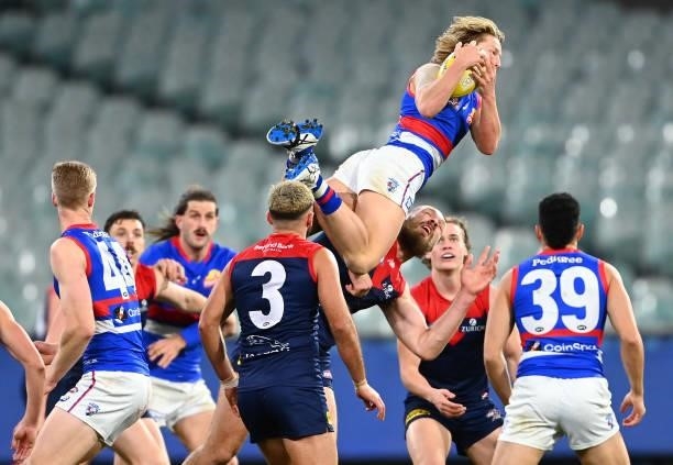 Cody Weightman of the Bulldogs marks over Max Gawn of the Demons during the round 20 AFL match between Melbourne Demons and Western Bulldogs at...
