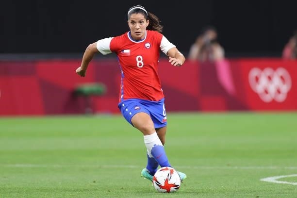 Karen Araya of Team Chile runs with the ball during the Women's First Round Group E match between Chile and Canada on day one of the Tokyo 2020...