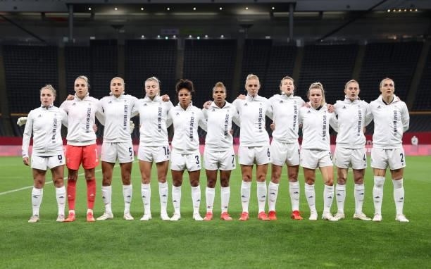 Players of Team Great Britain stand for the national anthem prior to the Women's First Round Group E match between Japan and Great Britain on day one...