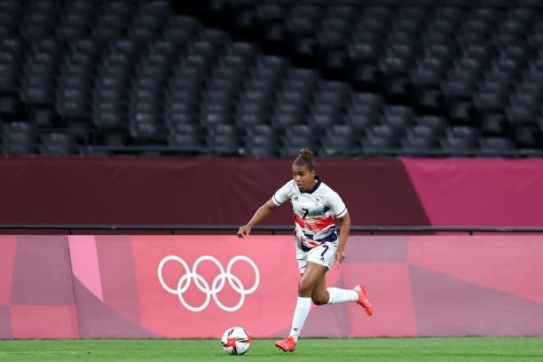 Nikita Parris of Team Great Britain runs with the ball as empty seats are seen during the Women's First Round Group E match between Japan and Great...