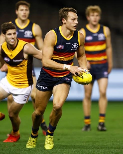 Tom Doedee of the Crows runs with the ball during the round 20 AFL match between Adelaide Crows and Hawthorn Hawks at Marvel Stadium on July 24, 2021...
