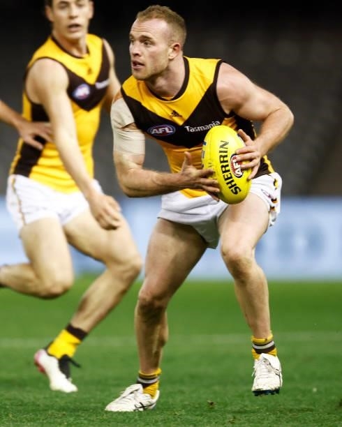 Tom Mitchell of the Hawks runs with the ball during the round 20 AFL match between Adelaide Crows and Hawthorn Hawks at Marvel Stadium on July 24,...