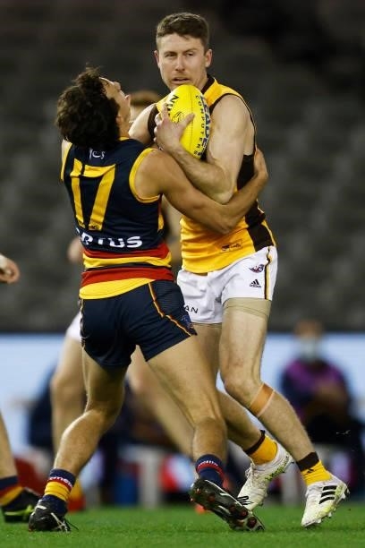 Liam Shiels of the Hawks is tackled by Will Hamill of the Crows during the round 20 AFL match between Adelaide Crows and Hawthorn Hawks at Marvel...