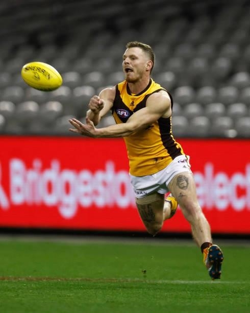 Blake Hardwick of the Hawks handballs during the round 20 AFL match between Adelaide Crows and Hawthorn Hawks at Marvel Stadium on July 24, 2021 in...