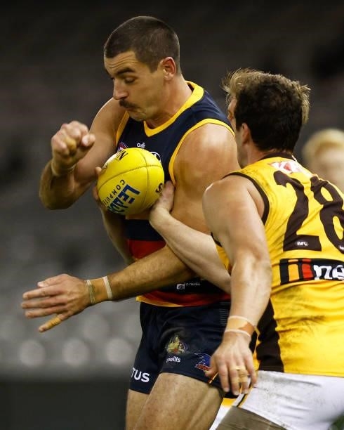 Taylor Walker of the Crows is tackled during the round 20 AFL match between Adelaide Crows and Hawthorn Hawks at Marvel Stadium on July 24, 2021 in...
