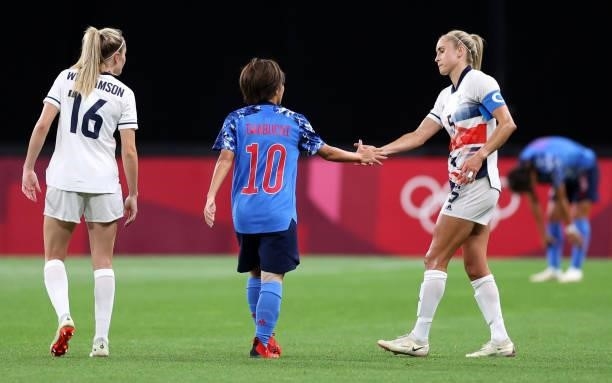 Steph Houghton of Team Great Britain shakes hands with Mana Iwabuchi of Team Japan following the Women's First Round Group E match between Japan and...