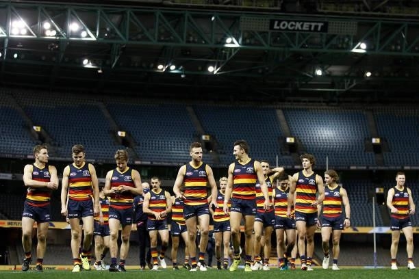 The Crows celebrate victory after the round 20 AFL match between Adelaide Crows and Hawthorn Hawks at Marvel Stadium on July 24, 2021 in Melbourne,...
