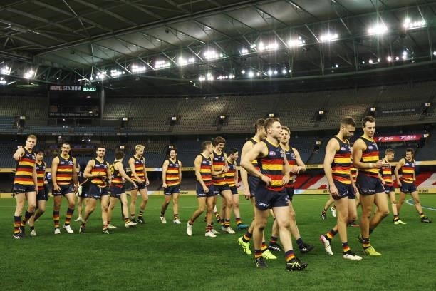 Adelaide Players celebrate their win during the round 20 AFL match between Adelaide Crows and Hawthorn Hawks at Marvel Stadium on July 24, 2021 in...