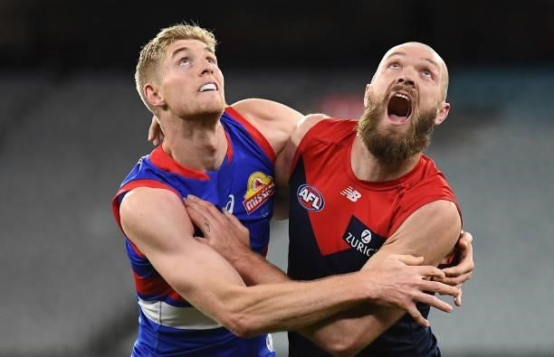 Tim English of the Bulldogs and Max Gawn of the Demons compete for the ball during the round 20 AFL match between Melbourne Demons and Western...