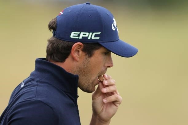 Nacho Elvira of Spain eats some chocolate as he leaves the fourth tee box during the third round of the Cazoo Open supported by Gareth Bale at Celtic...