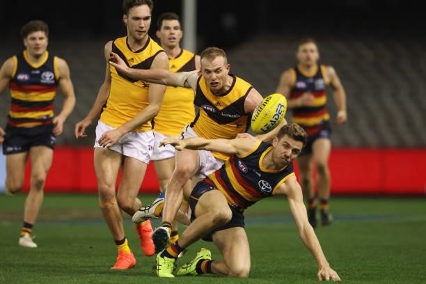 Tom Mitchell of the Hawks and Paul Seedsman of the Crows contest for the ball during the round 20 AFL match between Adelaide Crows and Hawthorn Hawks...