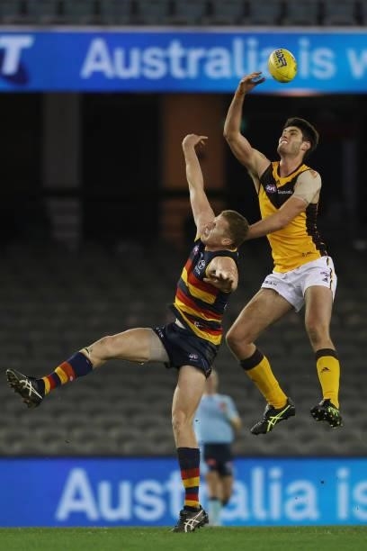 Ned Reeves of the Hawks wins a tap out during the round 20 AFL match between Adelaide Crows and Hawthorn Hawks at Marvel Stadium on July 24, 2021 in...