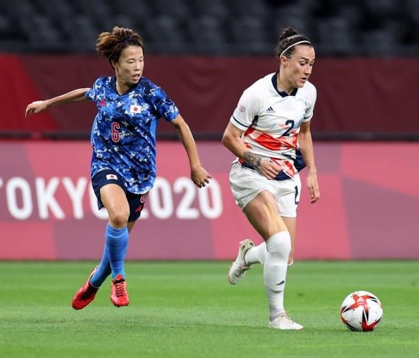Lucy Bronze of Team Great Britain is closed down by Hina Sugita of Team Japan during the Women's First Round Group E match between Japan and Great...
