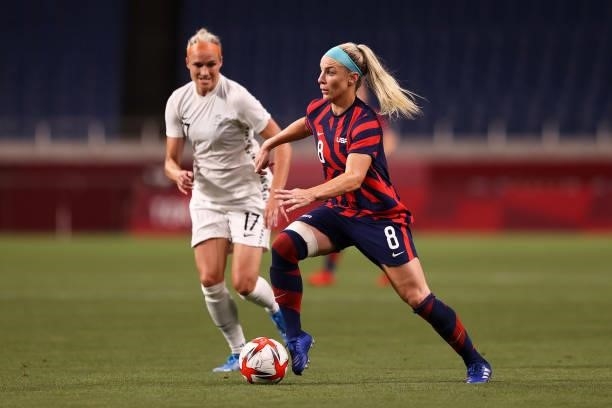 Julie Ertz of Team United States runs with the ball whilst under pressure from Hannah Wilkinson of Team New Zealand during the Women's First Round...